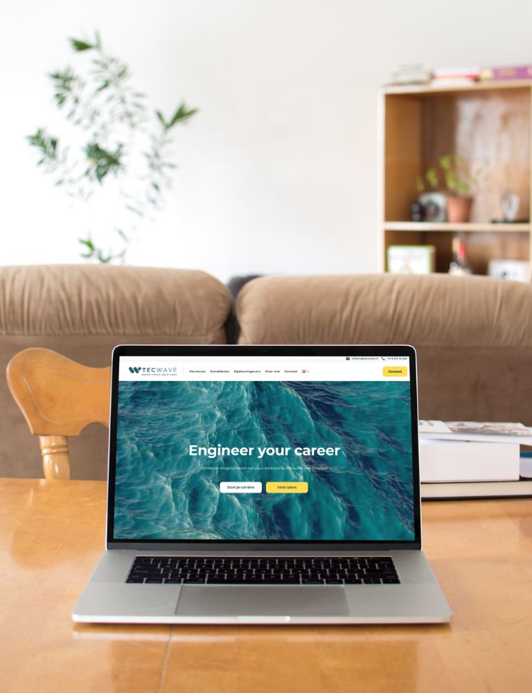 Laptop op een houten tafel met de website van Tecwave geopend, met de tekst 'Engineer your career' en een achtergrond van golvend water. Laptop op een houten tafel met de website van Tecwave geopend, met de tekst 'Engineer your career' en een achtergrond van golvend water.